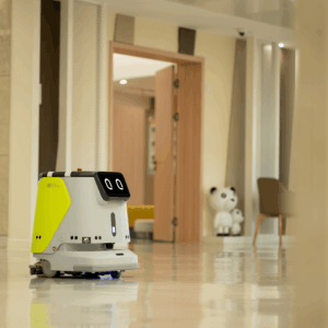 A hospitality tech robot cleaning a luxury hotel floor.